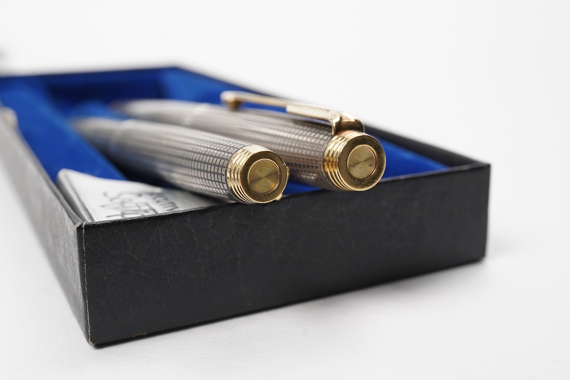 A Parker Sterling silver Cisele fountain pen and matching ballpen in original box along with a collector's pen case
